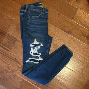 American Eagle Outfitters Women's Dark Blue Ripped Skinny Jeans
Size: 10 Long